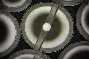 Top view of a sapphire micro assembly with central polished feature, showcasing an advanced custom sapphire part.