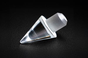Conical custom sapphire part with a precision-machined tip and integrated mounting section.