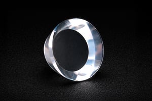 Transparent ring-shaped custom sapphire part with beveled edges and optical-grade surface finish.