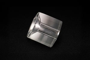 Macro internal view of a custom sapphire part with polished cylindrical geometry, highlighting precision machining and optical-grade finish.